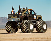 AUT 14 RK0814 02
1971 Chevrolet Monster Truck Gulf Oil Black And Gold 3/4 Rear View In Desert Blue Sky