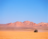 AUT 14 RK0816 04
Monster Truck Gulf Oil Black And Gold Driving Through Desert