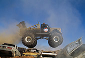 AUT 14 RK0821 03
1971 Chevrolet Monster Truck Gulf Oil Black And Gold Profile Airborne Over Crushed Cars