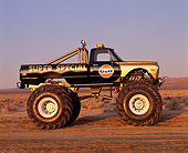 AUT 14 RK0852 09
1971 Chevrolet Monster Truck Gulf Oil Black And Gold Profile View On Dirt Blue Sky