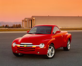 AUT 14 RK0964 02
2003 Chevrolet SSR Convertible Red Truck 3/4 Front View On Pavement By Airplane Hanger Filtered