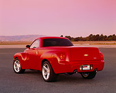 AUT 14 RK0968 01
2003 Chevrolet SSR Convertible Red Truck 3/4 Rear View On Pavement Filtered