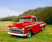 AUT 14 RK1048 03
1957 Chevrolet Cameo Red And White 3/4 Front View On Grass By Mountain