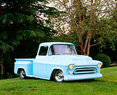 AUT 14 RK1057 01
1957 Chevy Pick Up Truck Pastel Aqua 3/4 Front View On Grass Trees Background