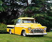 AUT 14 RK1063 02
1957 Chevy Cameo Carrier Pick Up Truck Yellow And Black 3/4 Front View On Grass Trees Background