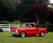 AUT 14 RK1083 05
1972 Chevy 1/2 Ton Pick Up Truck Orange 3/4 Side View On Grass By Trees