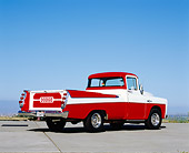 AUT 14 RK1093 04
1957 Dodge Sweptside Red And White Pick Up Truck 3/4 Rear View On Pavement Blue Sky