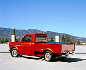 AUT 14 RK1111 03
1959 Datsun 1000 Orange Pick Up Truck 3/4 Rear View On Pavement
