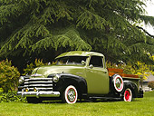 AUT 14 RK1140 01
1950 Chevrolet Pick Up Truck Green And Black 3/4 Front View On Grass By Tree