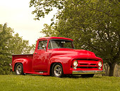 AUT 14 RK1145 01
1956 Ford F-100 Pick Up Truck Red 3/4 Front View On Grass By Trees