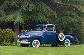 AUT 14 RK1153 01
1950 Chevrolet 3100 Pick Up Truck Blue 3/4 Side View On Grass By Trees