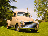 AUT 14 RK1157 01
1951 GMC 100 Pick Up Truck Sand 3/4 Front View On Grass By Trees