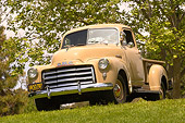 AUT 14 RK1159 01
1951 GMC 100 Pick Up Truck Sand Low 3/4 Front View On Grass By Trees