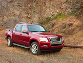AUT 14 RK1182 01
2007 Ford Explorer Sport Trac Pick Up Truck Red 3/4 Front View On Gravel