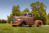 AUT 14 RK1210 01
1948 Ford F1 Unrestored Red Pick Up Truck Low 3/4 Side View On Grass
