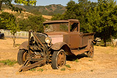 AUT 14 RK1214 01
Abandoned Rusty Truck 3/4 Front View In Dry Grass Field