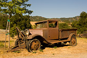 AUT 14 RK1215 01
Abandoned Rusty Truck 3/4 Side View In Dry Grass Field