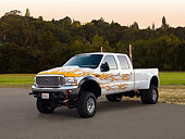 AUT 14 RK1222 01
2000 Ford F350 White With Flames Dually 3/4 Side View On Pavement