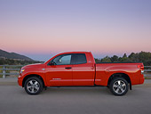 AUT 14 RK1245 01
2007 Toyota Tundra Double Cab SR5 Red Profile View On Pavement By Hills At Dusk
