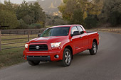 AUT 14 RK1250 01
2007 Toyota Tundra Double Cab SR5 Red 3/4 Front View On Pavement By Trees At Dusk