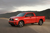 AUT 14 RK1254 01
2007 Toyota Tundra Double Cab SR5 Red 3/4 Side View On Pavement By Hills At Dusk