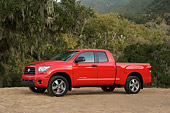 AUT 14 RK1259 01
2007 Toyota Tundra Double Cab SR5 Red 3/4 Side View On Dirt By Trees At Dusk