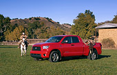 AUT 14 RK1265 01
2007 Toyota Tundra Double Cab SR5 Red 3/4 Side View On Grass By Wrangler On Horse