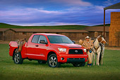 AUT 14 RK1268 05
2007 Toyota Tundra Double Cab SR5 Red 3/4 Side View On Grass By Wrangler And Horse