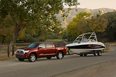 AUT 14 RK1278 01
2007 Toyota Tundra Crewmax Red Pearl 3/4 Side View With Boat On Pavement By Trees