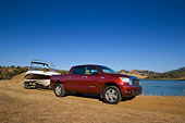 AUT 14 RK1281 01
2007 Toyota Tundra Crewmax Red Pearl 3/4 Side View With Boat On Sand By Water