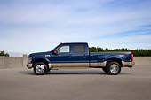 AUT 14 RK1288 01
2008 Ford F-450 Super Duty King Ranch Blue And Silver Profile View On Pavement