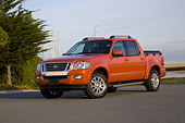 AUT 14 RK1290 01
2007 Ford Explorer Sport Trac Red Low 3/4 Front View On Pavement