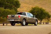 AUT 14 RK1301 01
2007 Nissan Titan 4x4 SE Gray Low 3/4 Rear View On Pavement By Trees