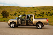 AUT 14 RK1305 01
2007 Nissan Titan 4x4 SE Gray Profile View On Pavement Doors Open By Hills