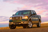 AUT 14 RK1310 01
2007 Ford F-150 King Ranch Lariat Green 3/4 Low Front View On Dirt