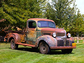 AUT 14 RK1352 01
1940 Dodge Pickup Truck Rusty Front 3/4 View On Grass By Trees
