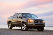AUT 14 RK1359 01
2008 Honda Ridgeline RTS Gray 3/4 Front View On Dirt By Water