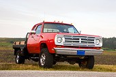 AUT 14 RK1366 01
1973 Dodge D Series Club Cab Flatbed Pickup Truck Red 3/4 Front View In Field
