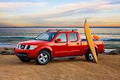 AUT 14 RK1387 01
2008 Nissan Frontier Crew Cab LE Pickup Truck Red 3/4 Front View At Beach