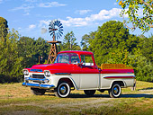 AUT 14 RK1390 01
1959 Chevrolet Apache Deluxe Pickup Truck Red And White 3/4 Front View On Grass By Trees