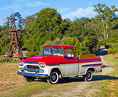 AUT 14 RK1391 01
1959 Chevrolet Apache Deluxe Pickup Truck Red And White 3/4 Front View On Grass By Trees