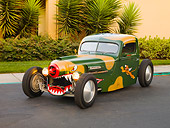 AUT 14 RK1392 01
1942 Ford Pickup Truck Custom Camouflage Warhawk Flying Tiger Art 3/4 Front View On Pavement By Building