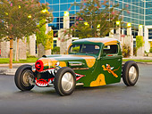 AUT 14 RK1394 01
1942 Ford Pickup Truck Custom Camouflage Warhawk Flying Tiger Art 3/4 Front View On Pavement By Building