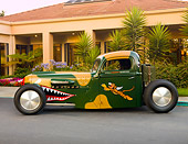 AUT 14 RK1396 01
1942 Ford Pickup Truck Custom Camouflage Warhawk Flying Tiger Art Profile View On Pavement By Building