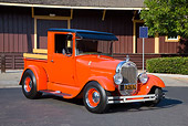 AUT 14 RK1407 01
1928 Ford Model A Pickup Truck Orange 3/4 Front View On Pavement By Building