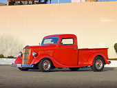 AUT 14 RK1420 01
1935 Ford Pickup Truck Red 3/4 Front View On Pavement By Fence
