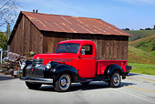 AUT 14 RK1481 01
1946 Chevrolet Pickup Truck Red And Black 3/4 Front View On Pavement By Barn