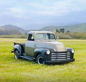AUT 14 RK1486 01
1949 Chevrolet 1/2 Ton Pickup Truck Tan 3/4 Front View On Grass By Hills
