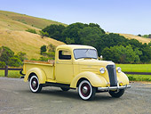 AUT 14 RK1495 01
1937 Chevrolet GC Pickup Truck Yellow 3/4 Front View On Road By Hills