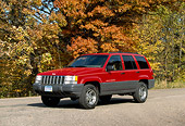 AUT 15 RK0110 01
1998 Jeep Grand Cherokee Red 3/4 Side View On Pavement By Trees